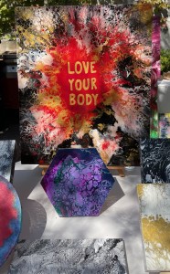 Some of the artwork from a previous Love Your Body event. Photo by Karen Salkin.