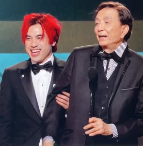 Then the red-haired guy moves over to the center, and doesn't let go of James Hong no matter where Mr. Hong moves his arm! Photo by Karen Salkin.