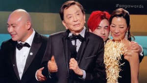 The bald guy finally usurps the red-haired one, who then moves over to stand behind James Hong and Michelle Yeoh, very creepily grabbing on to both the stars!!! Ewww. Photo by Karen Salkin.