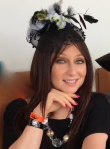 Karen Salkin modeling one of her many fascinators. (And jewelry and nails!) Photo by INAM staff.
