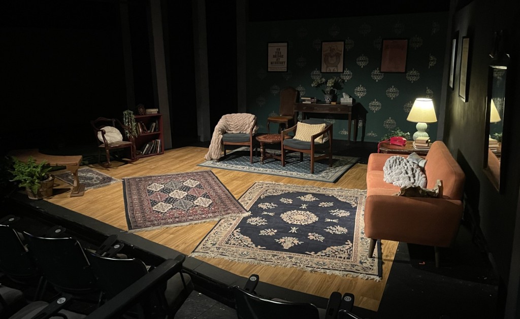 The dark set before the play begins, so the "outside" isn't visible yet.  Photo by Karen Salkin.