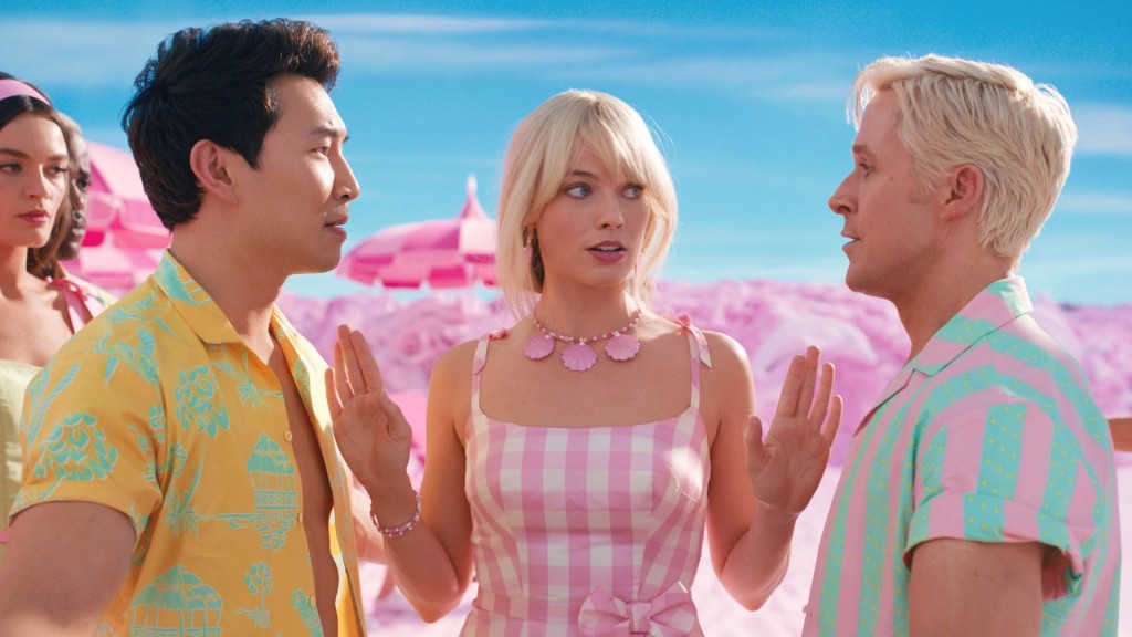 Simi Lui, (as one of the Kens, of course,) Margot Robbie, and Ryan Gosling as the main Ken. (Oysh.)