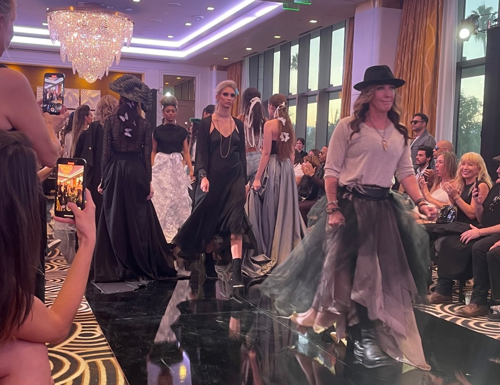 Christina Rahm leading the models in the finale of the Merci Dupre Fashion Show. Photo by Karen Salkin.