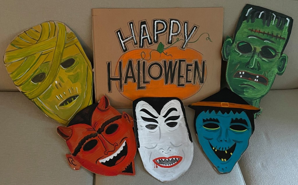 A Halloween mask display, all painted by Lisa Politz. Photo by Lisa Politz.