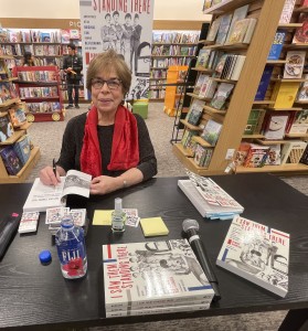 Debbie Gendler signing her new book, I Saw Them Standing There. Photo by Karen Salkin.