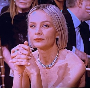 Lovely Carey Mulligan sitting at her table, possibly still reflecting on the extreme rudeness of the Netflix arrivals hostess, Bradley Cooper, and Jessica Chasten. Photo by Karen Salkin.