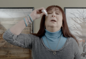 Karen Salkin in a 2018 web series using obvious eye drops to comically fake tears, and then...