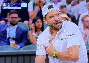 Grigor Dmitrov grabbing his torn pec. Photo by Karen Salkin, as is the one above.