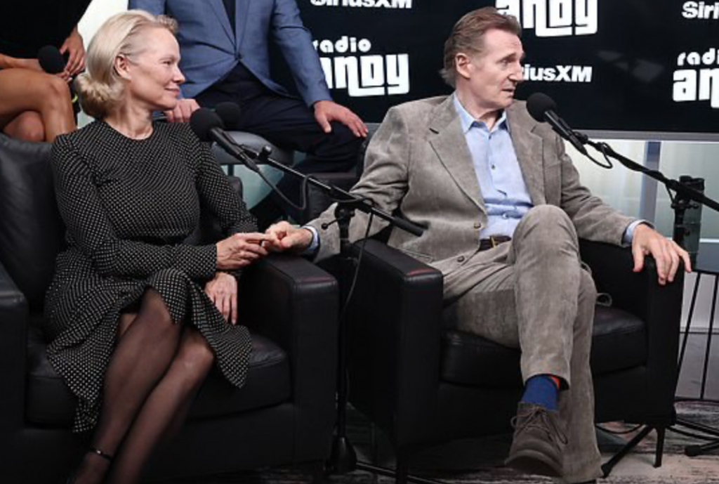 I adore that subtle little hand-hold of Pamela Anderson and Liam Neeson.