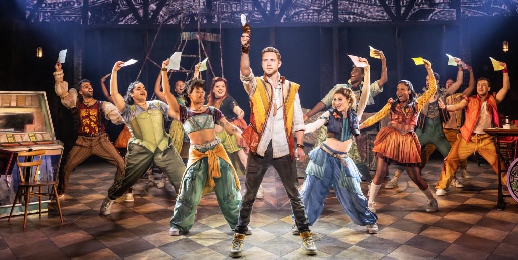 Corey Mach in the center, as Shakespeare. (Note the jukebox on the left, perhaps to remind us that this is a jukebox musical!) Photo by Matthew Murphy.