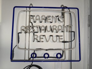 The neon sign used for the opening of my former TV show, Karen's Restaurant Revue. The words light up in pink while the outline of the "TV" lights up blue. Photo by Karen Salkin.
