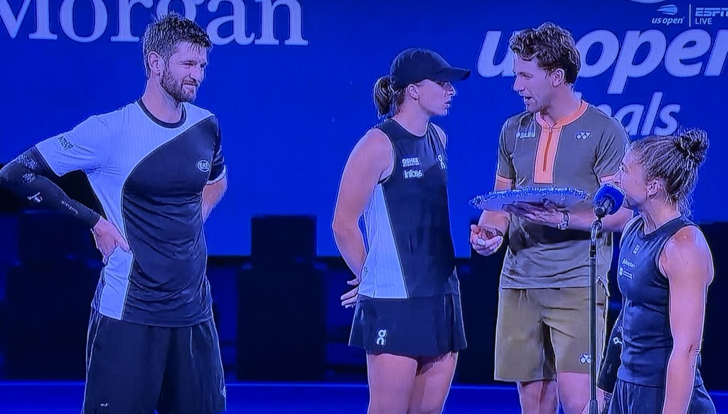 Iga Swiatek and Casper Ruud, (in the middle,) rudely talking to each other while Mixed Doubles Champion Sara Errani, (far right,) was trying to thank her partner, Andrea Vavassori, (on the far left.) Photo by Karen Salkin.