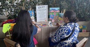 (L-R) Karen Salkin and Laura Saul starting their paintings, which is explained in the Lo Art section below. Photo by Lilly O'Brien.