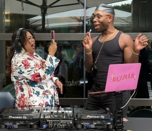 DJ Dazzler having some fun with one of the guests. Photo by Karen Salkin.