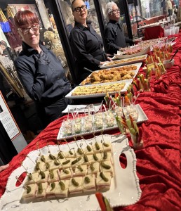 Part of the buffet, with the nice servers. Photo by Karen Salkin.
