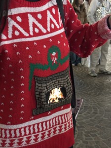 Mr. X and my famous Christmas Fireplace sweater that we trade off wearing during the holidays. Can you guess how that fireplace keeps going? Photo by Karen Salkin.