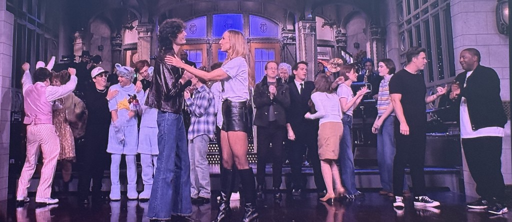 The SNL cast distancing themselves from the offensive Glaser woman at the end of the show. Photo by Karen Salkin, as is the one at the top of the page of the band's blank faces during Glaser's unfunny monologue.