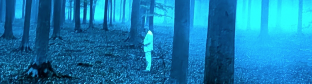 Jay Kelly in the Italian forest.