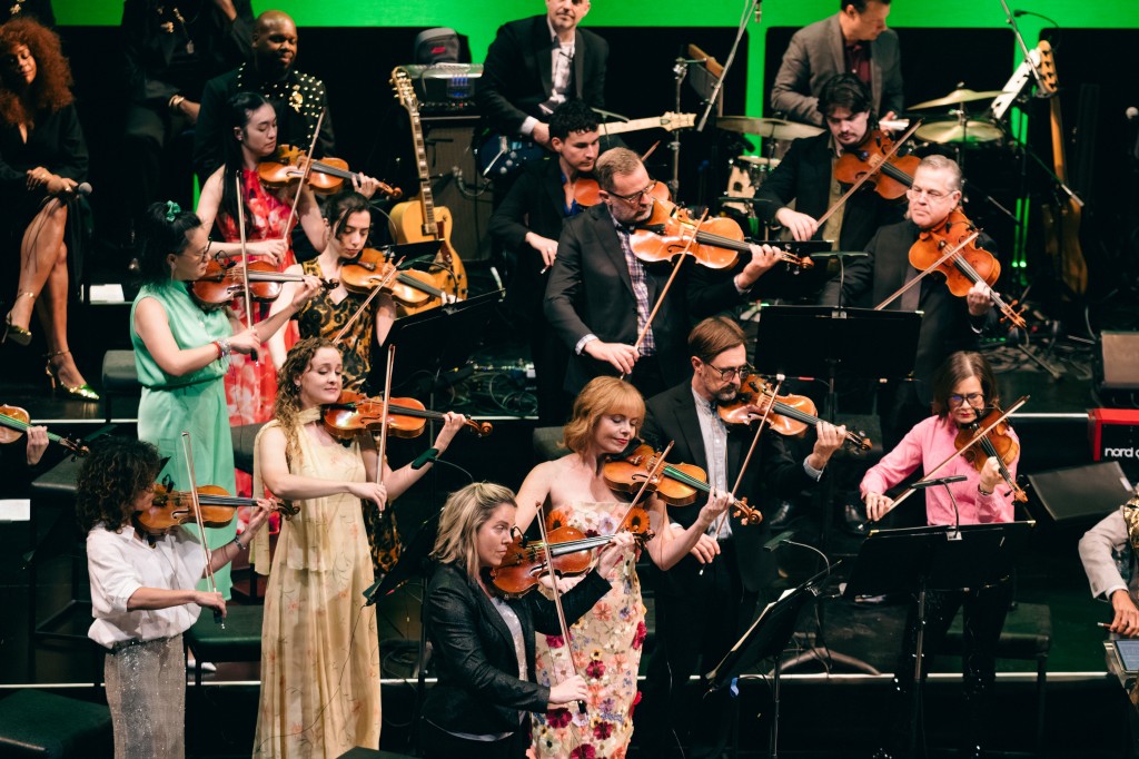 Part of the Muse/Ique orchestra. Notice the two members of the DC6 Singers Collective on the top left, who are totally feeling the music. I love that! Photo by Haoyuan Ren, and courtesy of Muse/Ique, as is the one at the top of this review.