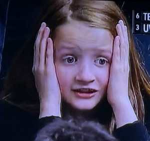 This little girl in the stands is mirroring everything yours truly goes through during March Madness!!! Photo by Karen Salkin.