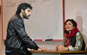 A student with the teacher, Marjan. in the play English. Photo by Kevin Parry. 